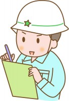 工事現場で働く男…