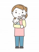 赤ん坊を抱き手を…