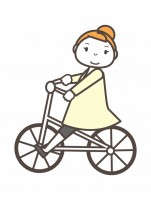 自転車に乗る女の…