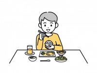 ご飯を食べる男の…